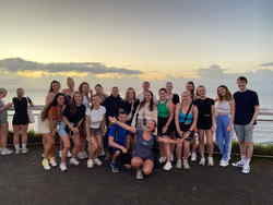 group of travellers in Byron Bay taking a photo together