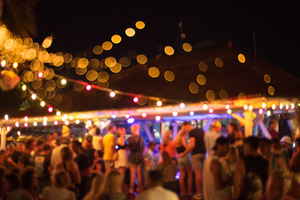 Young travellers at beach party