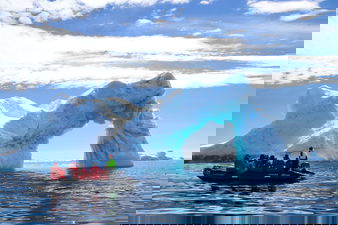 Travellers on Zodiac boat in Antarctica