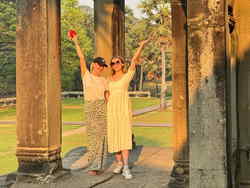Travellers at Angkor Wat at sunrise in Cambodia