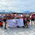 Travellers holding up a Gap 360 Thailand banner