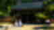 Traditional Hanok village with secluded palace grounds and two women dressed in pastel hanbok surrounded by green trees