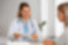 Group traveller talking to doctor about medical advice