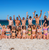 Group travellers on the beach in Australia on a Working Holiday Visa