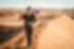 Group traveller walking through sand dunes in Africa
