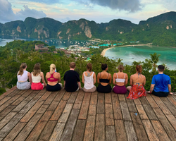 Group of travellers sat on the Koh Phi Phi viewpoint
