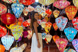 Traveller in front of colourful lanterns in Hoi An Vietnam