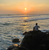 Traveller watching the sunset at Mirissa beach in Sri lanka