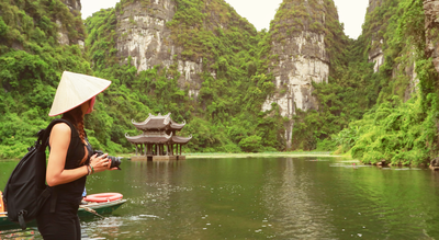 Woman looking over Ninh Binh lake in Vietnam